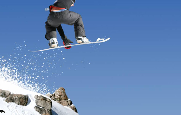 ski jump snowboard big air blue sky rock snow